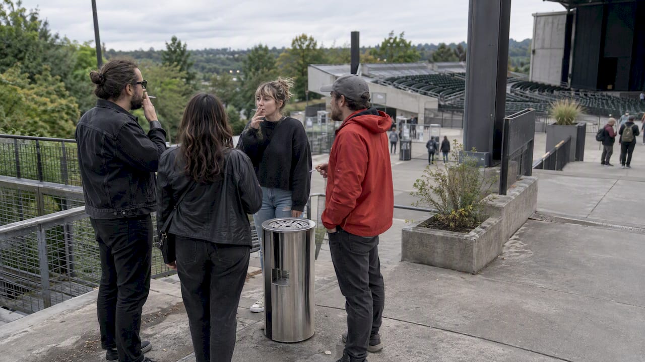 Concertgoers in a separate outdoor smoking area